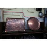 Two Newlyn Arts & Crafts hammered copper trays, by John Pearson, largest 49.5cm wide.