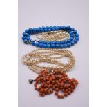 A strand of graduated cultured pearls, having 9ct gold clasp; together with a string of coral beads;