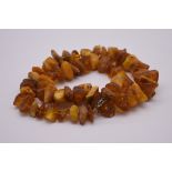 A chunky amber piece necklace, 56cm, 83g.