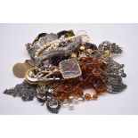 A selection of costume jewellery, to include beaded necklaces, brooches and badges.