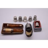 Seven various silver thimbles, one cased, 32.5g; together with a cased silver mounted meerschaum and