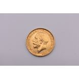 Coins: a George V 1914 gold sovereign.