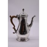 A George III silver coffee pot, by Daniel Smith & Robert Sharp, London 1764, 26cm high, 907g all in.