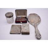 A small quantity of silver and silver mounted items, to include: an engine turned cigarette case and