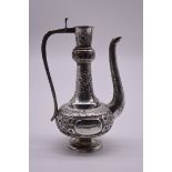 An Arabic white metal dallah coffee pot, stamped 'S.T.Silver', 21cm high,468g, (a/f).