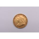 Coins: a Victoria 1894 gold sovereign.