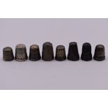 Six silver thimbles, 20.5g; together with two others. (8)