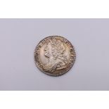 Coins: a George II 1741 silver sixpence.
