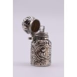 A Victorian miniature embossed silver perfume flask, by C C May & Sons, Birmingham 1889, 3.5cm.
