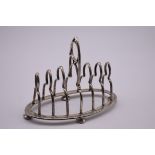 A Victorian six section toast rack, by Elkington & Co Ltd, Birmingham 1898, 12.5cm high, 293g.