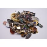 A quantity of costume jewellery, to include bangles and badges.