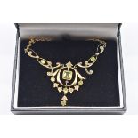 An Edwardian peridot and seed pearl gold pendant necklace, stamped 9ct, 6.6g gross weight.