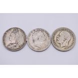 Coins: a George III 1819 silver crown; together with a Victoria 1891 crown; and a George V 1935