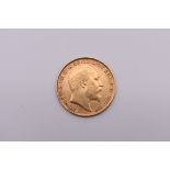 Coins: an Edward VII 1910 gold half sovereign.