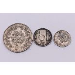 Coins: an Egyptian Qirsh silver coin; together with two other Egyptian coins. (3)