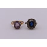 An oval amethyst gold ring; hallmarked 375; together with another gold dress ring stamped 9ct &