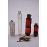 Two cranberry glass perfume bottles; together with three other examples, (a.f).