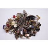 A selection of Victorian and later costume jewellery, to include a silver baby's rattle, a pair of