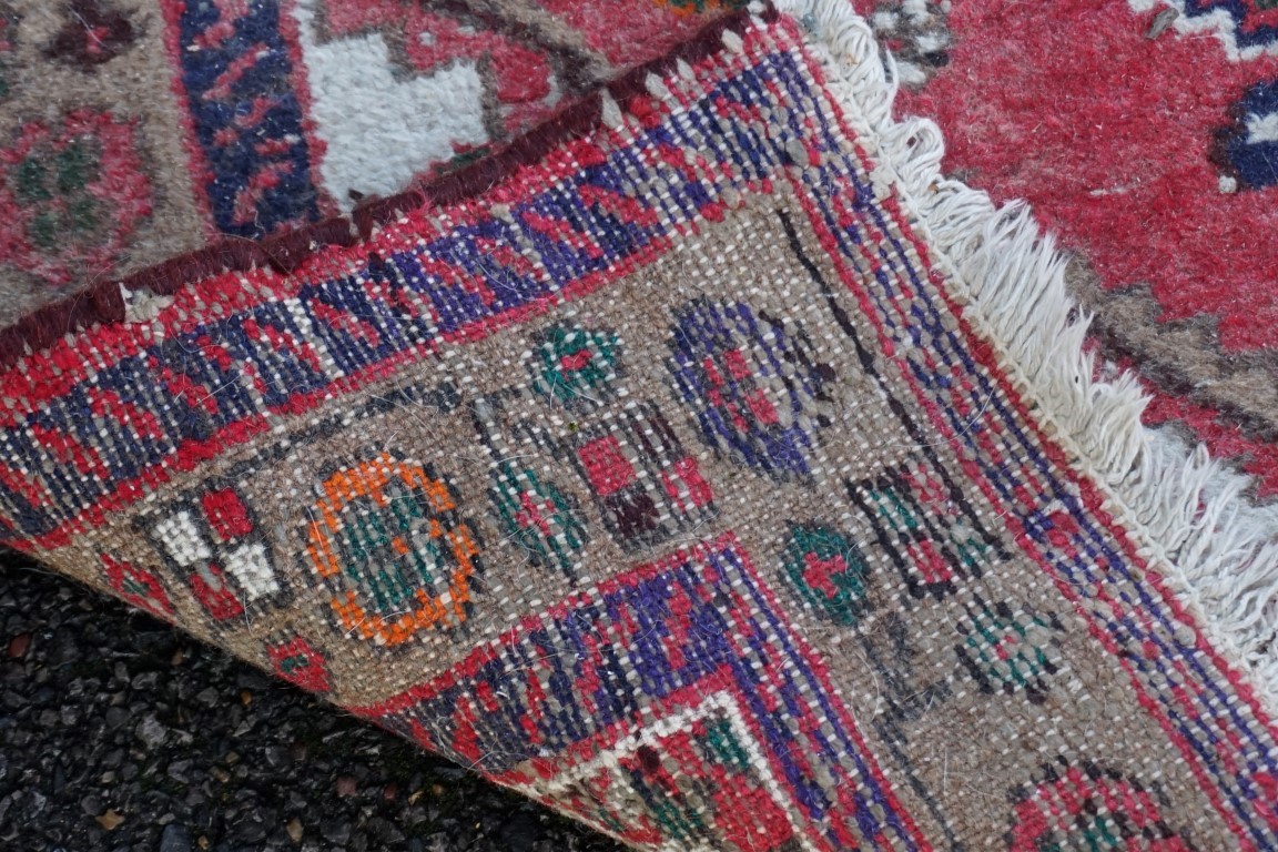 An old Persian rug, having central medallion with floral borders, 148 x 110cm. - Image 3 of 3