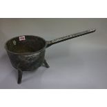 An antique bronze skillet, the handle inscribed 'Warner 5P', 46cm long.