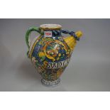 An antique maiolica wet drug jar, dated 1676, 28cm high.