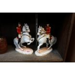 A pair of Augarten Wien equestrian figures, 24cm high.