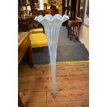 A very large vaseline glass trumpet vase, 102.5cm high.