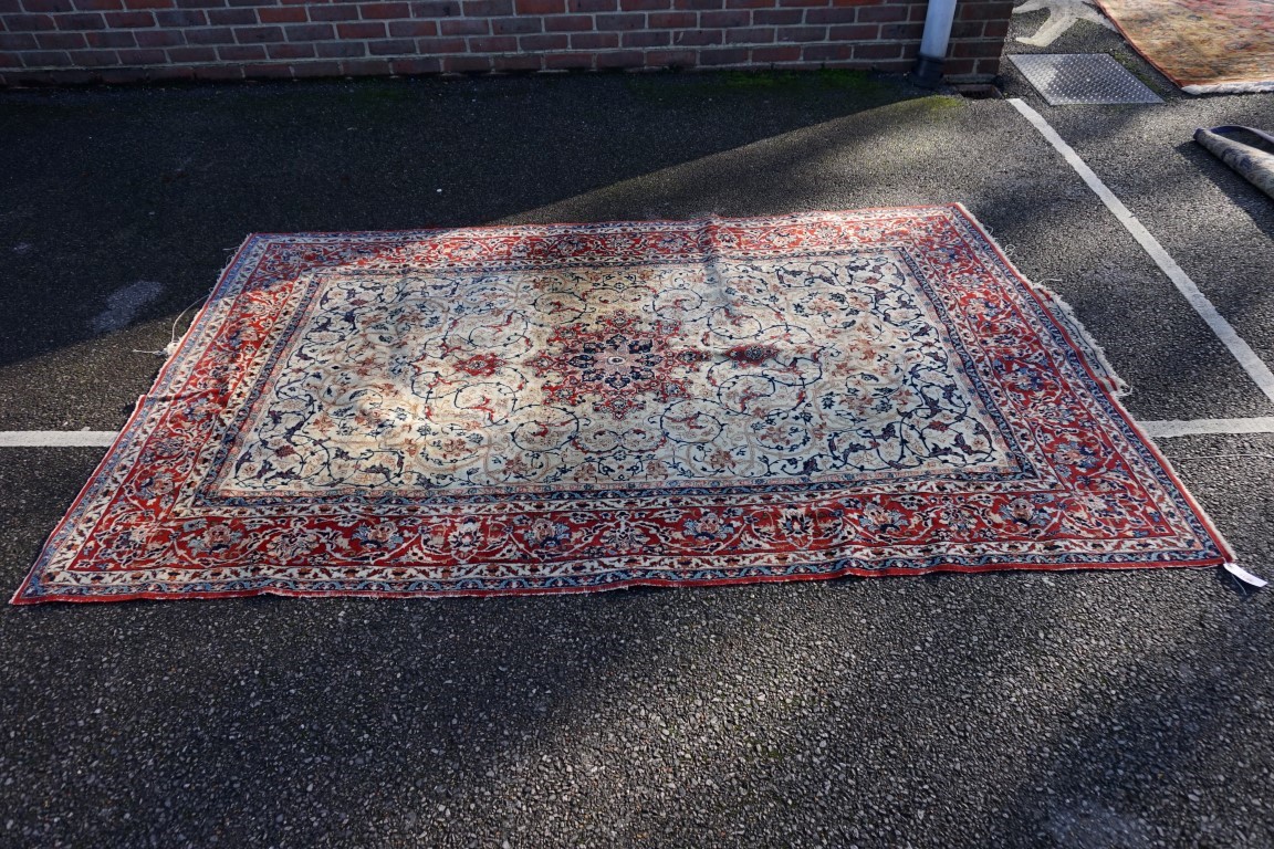 A signed Isfahan rug, 240 x 148cm.