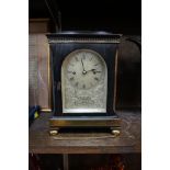 A 19th century ebonized and brass twin fusee library clock, the silvered dial inscribed 'Morse
