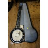 An antique six string banjo, by Cammeyer, inscribed 'Grade 3', in case.