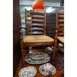 A good set of ten reproduction oak and rush seated ladderback dining chairs, to include a pair of