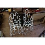 An unusual pair of novelty horseshoe garden chairs.