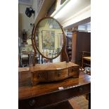 An antique mahogany serpentine fronted toilet mirror, 42.5cm wide.