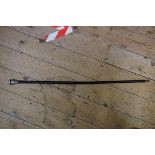 A Chinese white metal mounted carved wood cane, 92cm long.