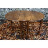 An old oak two flap table. This lot can only be collected on Saturday 19th December (9-2pm).