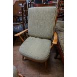 An Ercol armchair; together with a pair of footstools.