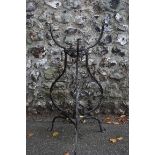 A wrought iron plant holder having blooming flower motif. This lot can only be collected on Saturday