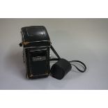 Cameras: a Yashica MAT-124, with lens and leather case.