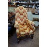 A William & Mary style carved walnut and upholstered armchair.