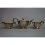 A Chinese silver three piece teaset, by C J & Co, late 19th/early 20th century, 1244g, teapot 14.5cm