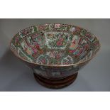 A large Chinese Canton famille rose bowl, 40cm diameter, (a.f.), on wood stand.