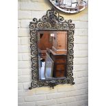 (THH) A cast brass framed wall mirror, 80.5 x 50cm.