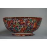 A Chinese Canton famille rose bowl, painted with panels of figures, 28.5cm diameter, (damage and