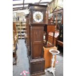 A reproduction oak longcase clock, striking on eight straight gongs, 192cm high, with three