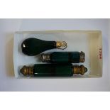 Three antique green glass scent bottles, largest 15cm long.