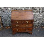A mahogany and oak bureau, 91cm high x 76cm wide x 43.5cm deep. This lot can only be collected on
