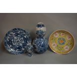 A small group of Chinese and Japanese porcelain, comprising: a yellow ground dish, Guangxu six