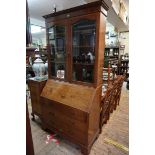 An Edwardian mahogany and inlaid bureau bookcase, 113cm wide.