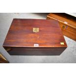 A 19th century stained oak casket, the hinged cover enclosing two removable trays, 47.5cm wide.
