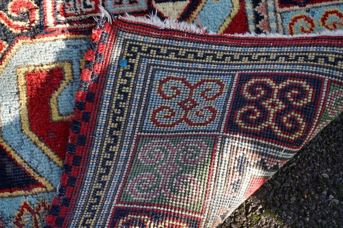 A Persian rug, having geometric borders, 198 x 140cm; together with one other rug having floral - Image 4 of 5